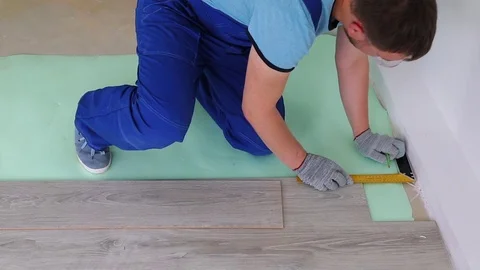 Professional laying laminate on the floor Stock Footage 76523473