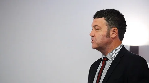 Professional Lector in Stylish Dark Suit Talks to Audience Vídeo Stock 80432616