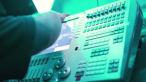 Professional lighting control console operated by technician during night event. Stock Footage 325831840