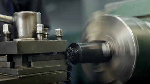 Professional locksmith is working at a lathe with plastic part inner part Stock Footage 285643083