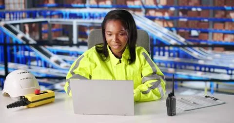 Professional Logistic Engineer Overseeing Warehouse Operations On Computer Da Stock Photos
