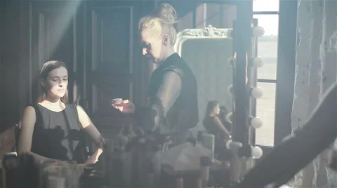 Professional make-up artist applying blush or eyeshadow using a brush Stock Footage 52266784