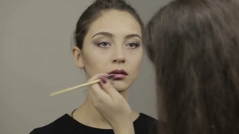 Professional Make-Up Artist Applying Lips Stock Footage 72899793