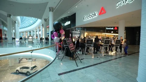 Professional Make up Artist Applying Makeup On The Face Of The Visitors At Mall Video stock 103057597