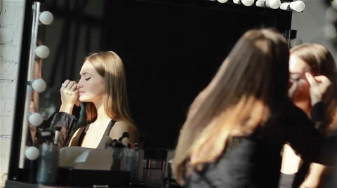 Professional make-up artist applying winged eyeliner. Prepare for shooting Stock Footage 52992641