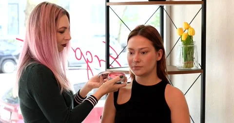 Professional Make-up artist doing glamour model makeup at work Stock Footage 311217996