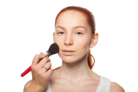 Professional Make-up artist doing glamour with red hair model makeup.  Isolated Stock Photos
