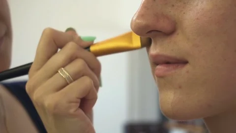Professional make-up artist making face makeup art. Make up and fashion concept Stock Footage 77677399