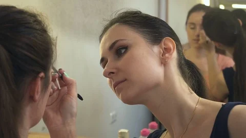 Professional make-up artist making face makeup art. Make up and fashion concept Stock Footage 77678931