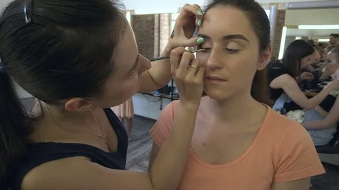 Professional make-up artist making face makeup art. Make up and fashion concept Stock Footage 77680551