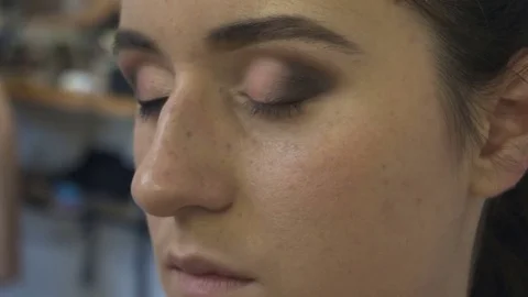 Professional make-up artist making face makeup art. Make up and fashion concept Stock Footage 77682141