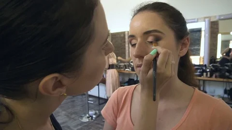 Professional make-up artist making face makeup art. Make up and fashion concept Stock Footage 77683394