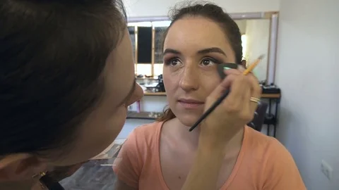 Professional make-up artist making face makeup art. Make up and fashion concept Stock Footage 77686725
