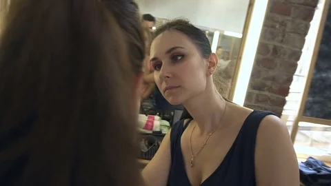 Professional make-up artist making face makeup art. Make up and fashion concept Stock Footage 77687796