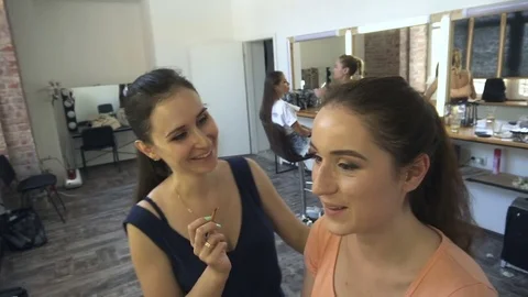 Professional make-up artist making face makeup art. Make up and fashion concept Stock Footage 77688033
