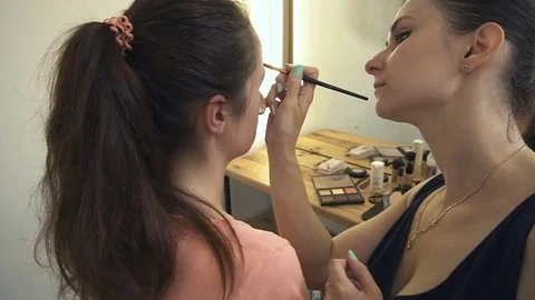 Professional make-up artist making face makeup art. Make up and fashion concept Stock Footage 77748655