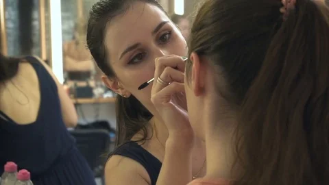 Professional make-up artist making face makeup art. Make up and fashion concept Stock Footage 77749366