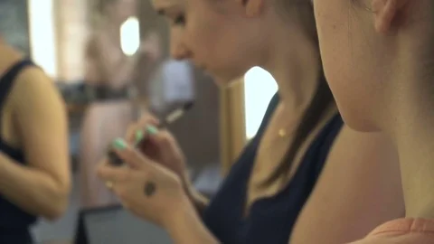 Professional make-up artist making face makeup art. Make up and fashion concept Stock Footage 77751444