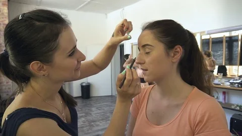Professional make-up artist making face makeup art. Make up and fashion concept Stock Footage 77755850
