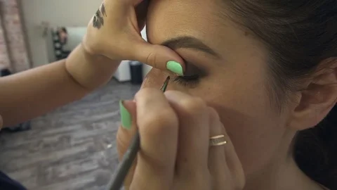 Professional make-up artist making face makeup art. Make up and fashion concept Stock Footage 77756785