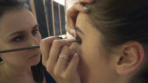 Professional make-up artist making face makeup art. Make up and fashion concept Stock Footage 77757221