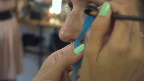 Professional make-up artist making face makeup art. Make up and fashion concept Stock Footage 77759825