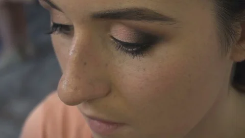 Professional make-up artist making face makeup art. Make up and fashion concept Stock Footage 77760521