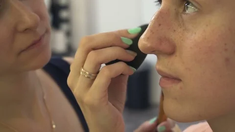 Professional make-up artist making face makeup art. Make up and fashion concept Stock Footage 77819969