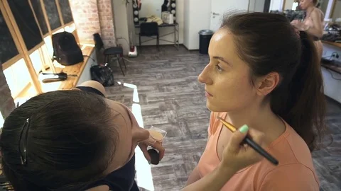 Professional make-up artist making face makeup art. Make up and fashion concept Stock Footage 77820278