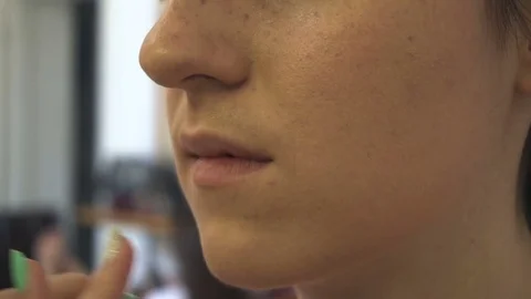 Professional make-up artist making face makeup art. Make up and fashion concept Stock Footage 77820488