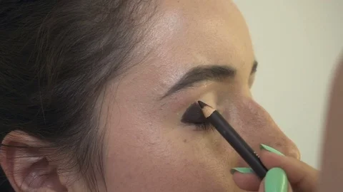 Professional make-up artist making face makeup art. Make up and fashion concept Stock Footage 77820733