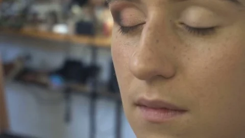 Professional make-up artist making face makeup art. Make up and fashion concept Stock Footage 77820877