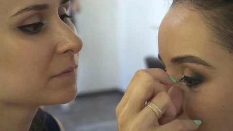 Professional make-up artist making face makeup art. Make up and fashion concept Stock Footage 77821885