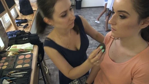 Professional make-up artist making face makeup art. Make up and fashion concept Stock Footage 77822202