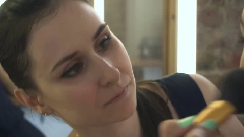Professional make-up artist making face makeup art. Make up and fashion concept Stock Footage 77822923