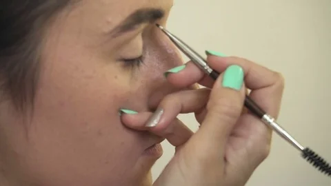 Professional make-up artist making face makeup art. Make up and fashion concept Stock Footage 78072750