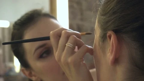 Professional make-up artist making face makeup art. Make up and fashion concept Stock Footage 78075265