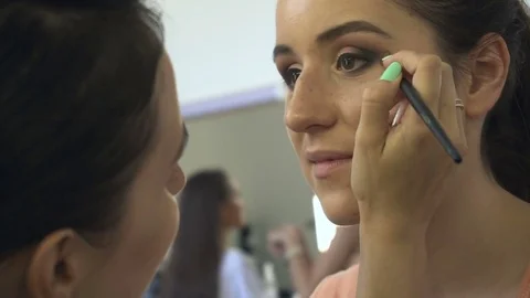 Professional make-up artist making face makeup art. Make up and fashion concept Stock Footage 78076340