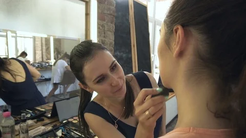 Professional make-up artist making face makeup art. Make up and fashion concept Stock Footage 78077866