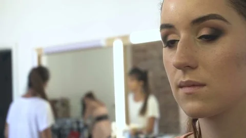 Professional make-up artist making face makeup art. Make up and fashion concept Stock Footage 78078231