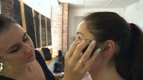 Professional make-up artist making face makeup art. Make up and fashion concept Stock Footage 78123576