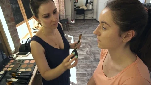 Professional make-up artist making face makeup art. Make up and fashion concept Stock Footage 78124195