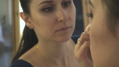 Professional make-up artist making face makeup art. Make up and fashion concept Stock Footage 78129177