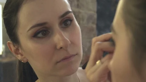 Professional make-up artist making face makeup art. Make up and fashion concept Stock Footage 78129457