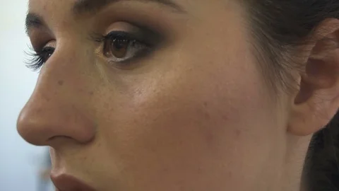 Professional make-up artist making face makeup art. Make up and fashion concept Stock Footage 78132276