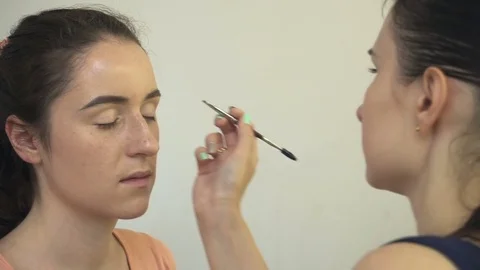 Professional make-up artist making face makeup art. Make up and fashion concept Stock Footage 79006251