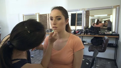 Professional make-up artist making face makeup art. Make up and fashion concept Stock Footage 79006762