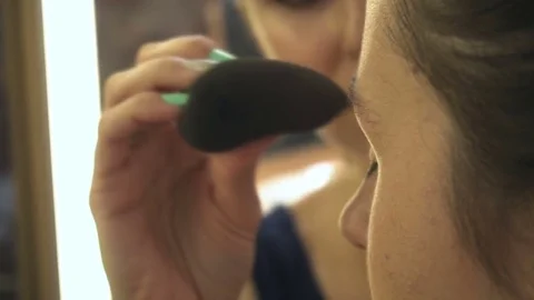 Professional make-up artist making face makeup art. Make up and fashion concept Stock Footage 79048804