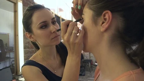 Professional make-up artist making face makeup art. Make up and fashion concept Stock Footage 79053998