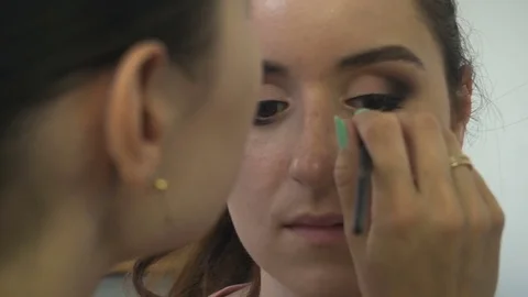 Professional make-up artist making face makeup art. Make up and fashion concept Stock Footage 79060546